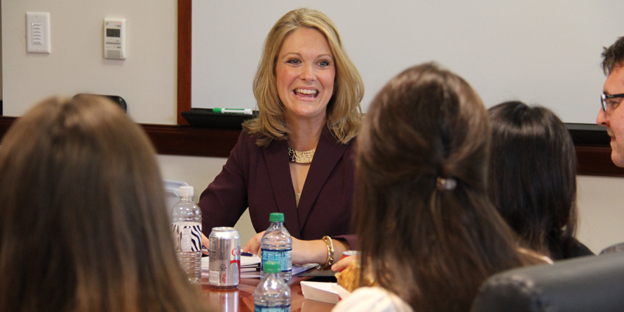 alumna meets with students